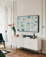 Harbor Windows V Crop by Melissa Averinos. shown as a framed stretched canvas in a living room above a console. Available as a archival giclee rolled canvas, fine art paper, or poster print. SKU 24994i.