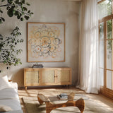 Henna Mandala II by Melissa Averinos. Shown in a natural wood frame in a cozy modern living room. Available as an archival giclee rolled canvas, fine art paper, or poster print. SKU 29112a.