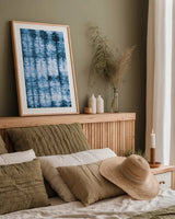 Kanari II Indigo by Melissa Averinos. shown as a paper print in a natural frame. Available as a archival giclee rolled canvas, fine art paper, or poster print. SKU 43114h.