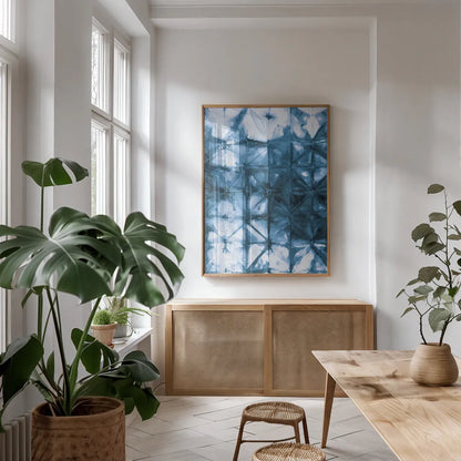Kanari IV Indigo by Melissa Averinos. shown as a print in a natural wood frame in a dining room. Available as a archival giclee rolled canvas, fine art paper, or poster print. SKU 43116h.