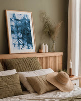 Kanari IV Indigo by Melissa Averinos. shown as a paper print in a natural frame. Available as a archival giclee rolled canvas, fine art paper, or poster print. SKU 43116h.
