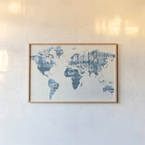 Kanari Map Indigo by Melissa Averinos. shown as a paper print in a natural frame. Available as a archival giclee rolled canvas, fine art paper, or poster print. SKU 43216i.