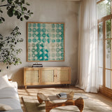 Kanari Square I by Melissa Averinos. Shown in a natural wood frame in a cozy modern living room. Available as an archival giclee rolled canvas, fine art paper, or poster print. SKU 42880a.