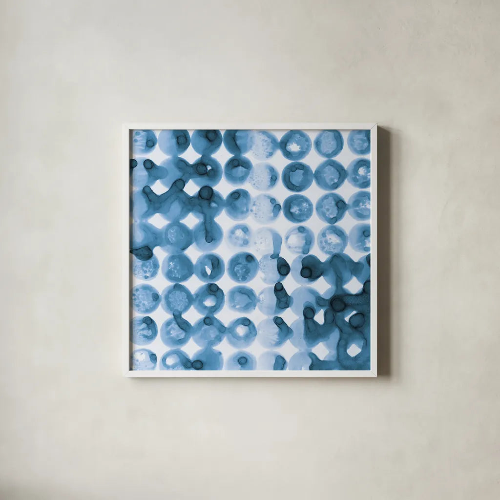 Kanari Square II Indigo by Melissa Averinos. Shown in a crisp white glass frame for a clean and minimalist style. Available as an archival giclee rolled canvas, fine art paper, or poster print. SKU 43112a.