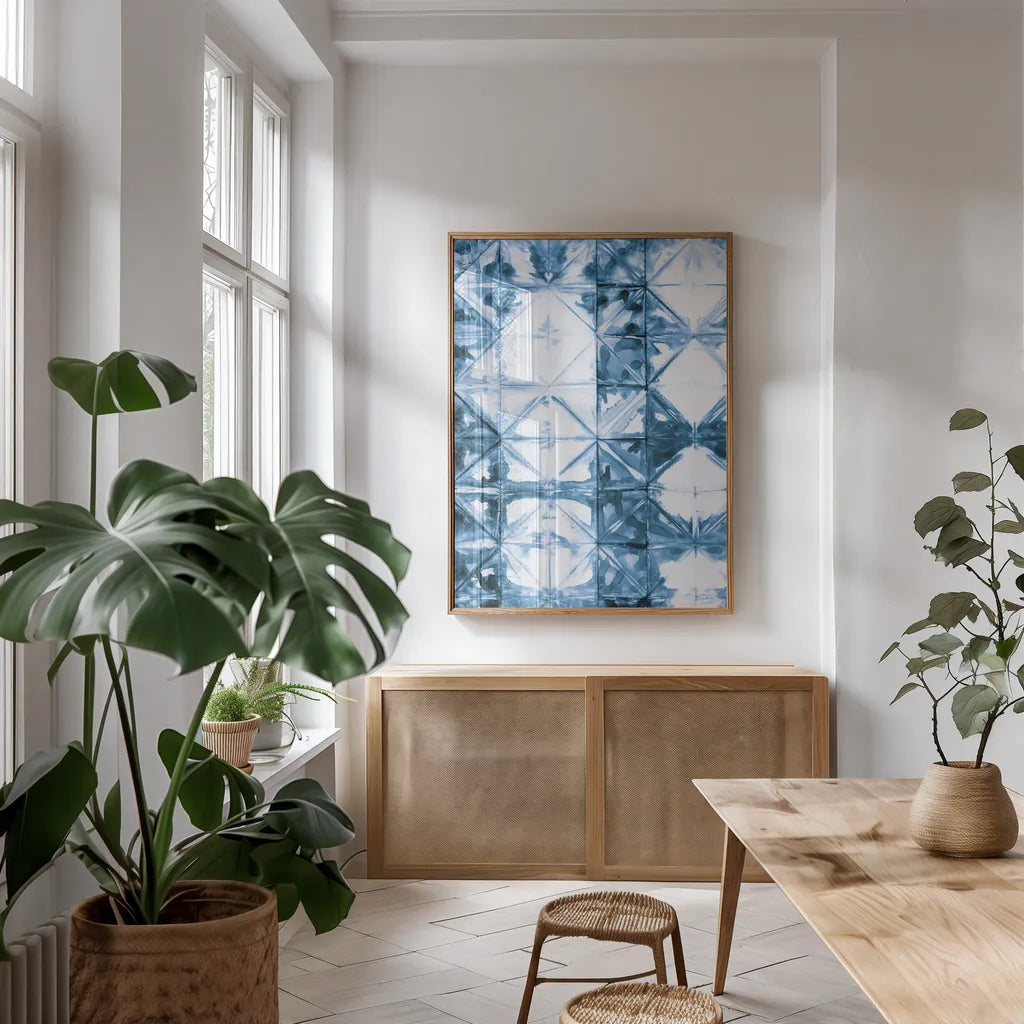 Kanari VI Indigo by Melissa Averinos. shown as a print in a natural wood frame in a dining room. Available as a archival giclee rolled canvas, fine art paper, or poster print. SKU 43118h.