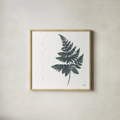 Nordic Fern II by Melissa Averinos. Shown in a natural wood glass frame for a timeless modern aesthetic. Available as an archival giclee rolled canvas, fine art paper, or poster print. SKU 57295a.