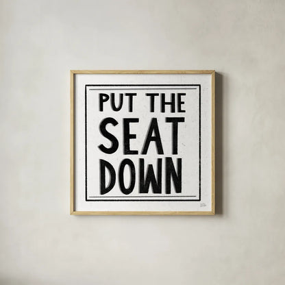 Put the Seat Down by Melissa Averinos. Shown in a natural wood glass frame for a timeless modern aesthetic. Available as an archival giclee rolled canvas, fine art paper, or poster print. SKU 59180a.