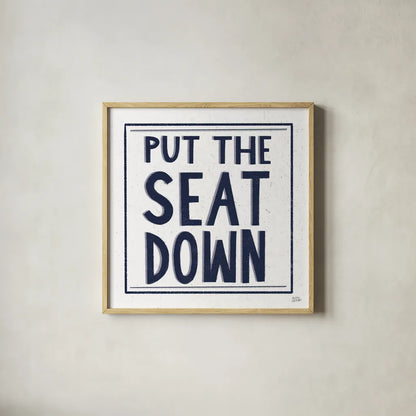 Put the Seat Down Navy by Melissa Averinos. Shown in a natural wood glass frame for a timeless modern aesthetic. Available as an archival giclee rolled canvas, fine art paper, or poster print. SKU 59464a.