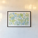 Seaglass Abstract by Melissa Averinos. shown as a paper print in a black flame. Available as a archival giclee rolled canvas, fine art paper, or poster print. SKU 47192i.