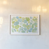 Seaglass Abstract by Melissa Averinos. shown as a paper print in a white frame. Available as a archival giclee rolled canvas, fine art paper, or poster print. SKU 47192i.