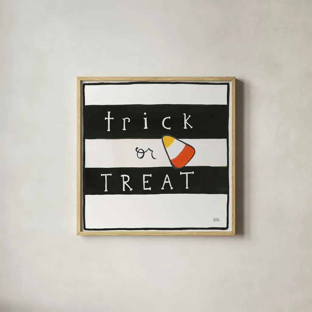 Trick or Treat by Melissa Averinos. Shown in a natural wood glass frame for a timeless modern aesthetic. Available as an archival giclee rolled canvas, fine art paper, or poster print. SKU 57877a.