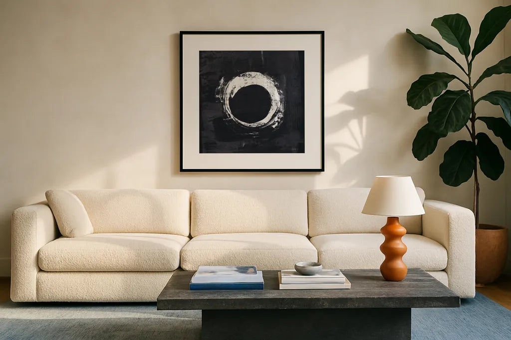 Zen Circle I Black Crop by Melissa Averinos. Displayed in a glass frame with matte in a clean modern living room. Available as an archival giclee rolled canvas, fine art paper, or poster print. SKU 54813a.