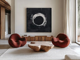 Zen Circle I Black Crop by Melissa Averinos. Shown as extra-large giant wall art in a modern living room. Available as an archival giclee rolled canvas, fine art paper, or poster print. SKU 54813a.