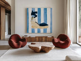Beach Glam VI Navy on Stripes by Mercedes Lopez Charro. Shown as extra-large giant wall art in a modern living room. Available as an archival giclee rolled canvas, fine art paper, or poster print. SKU 71995a.
