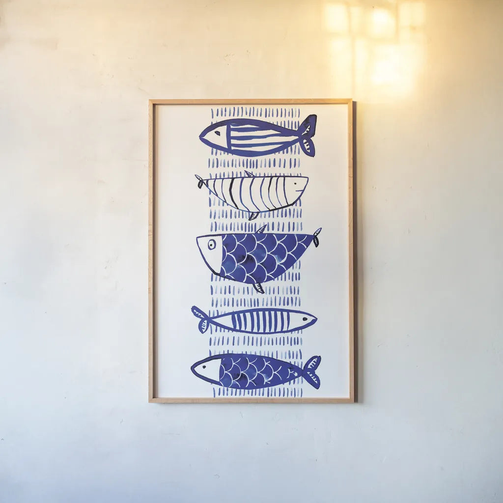 Blue Fish II by Mercedes Lopez Charro. shown as a paper print in a natural frame. Available as a archival giclee rolled canvas, fine art paper, or poster print. SKU 77494h.