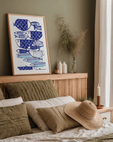 Blue Fish III by Mercedes Lopez Charro. shown as a paper print in a natural frame. Available as a archival giclee rolled canvas, fine art paper, or poster print. SKU 77495h.