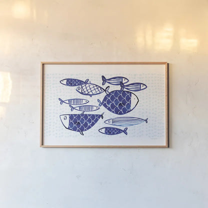 Blue Fish IV by Mercedes Lopez Charro. shown as a paper print in a natural frame. Available as a archival giclee rolled canvas, fine art paper, or poster print. SKU 79252i.