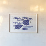 Blue Fish IV by Mercedes Lopez Charro. shown as a paper print in a white frame. Available as a archival giclee rolled canvas, fine art paper, or poster print. SKU 79252i.