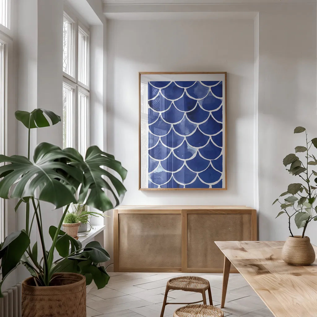 Blue Fish Waves by Mercedes Lopez Charro. shown as a print in a natural wood frame in a dining room. Available as a archival giclee rolled canvas, fine art paper, or poster print. SKU 77496h.
