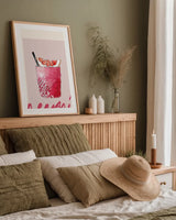 Cheers I by Mercedes Lopez Charro. shown as a paper print in a natural frame. Available as a archival giclee rolled canvas, fine art paper, or poster print. SKU 85672h.