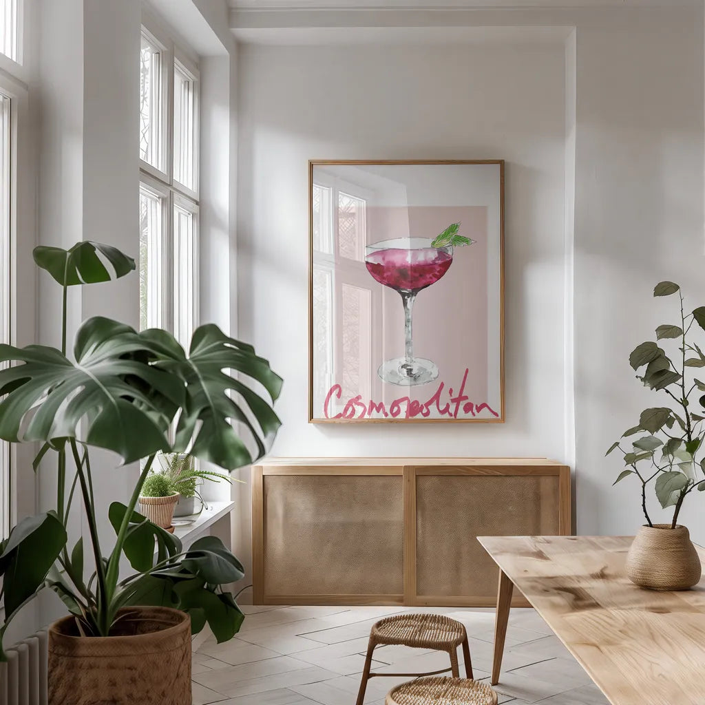 Cheers II on White by Mercedes Lopez Charro. shown as a print in a natural wood frame in a dining room. Available as a archival giclee rolled canvas, fine art paper, or poster print. SKU 91158h.