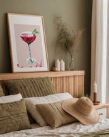Cheers II on White by Mercedes Lopez Charro. shown as a paper print in a natural frame. Available as a archival giclee rolled canvas, fine art paper, or poster print. SKU 91158h.