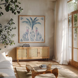 Chinoiserie Dogs I by Mercedes Lopez Charro. Shown in a natural wood frame in a cozy modern living room. Available as an archival giclee rolled canvas, fine art paper, or poster print. SKU 94607a.