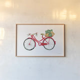 Christmas Delivery II by Mercedes Lopez Charro. shown as a paper print in a natural frame. Available as a archival giclee rolled canvas, fine art paper, or poster print. SKU 71532i.