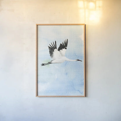 Crane in Flight I by Mercedes Lopez Charro. shown as a paper print in a natural frame. Available as a archival giclee rolled canvas, fine art paper, or poster print. SKU 77497h.