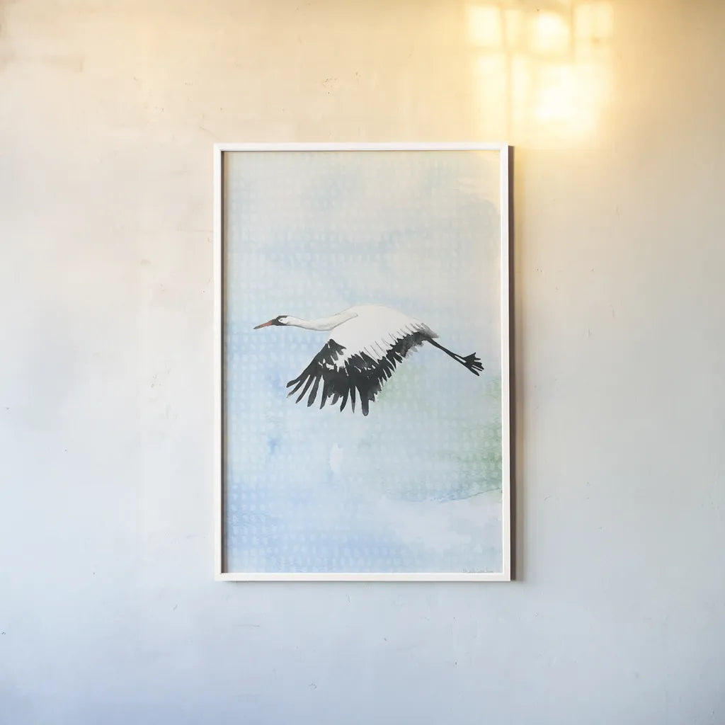 Crane in Flight II by Mercedes Lopez Charro. shown as a paper print in a white frame. Available as a archival giclee rolled canvas, fine art paper, or poster print. SKU 77498h.