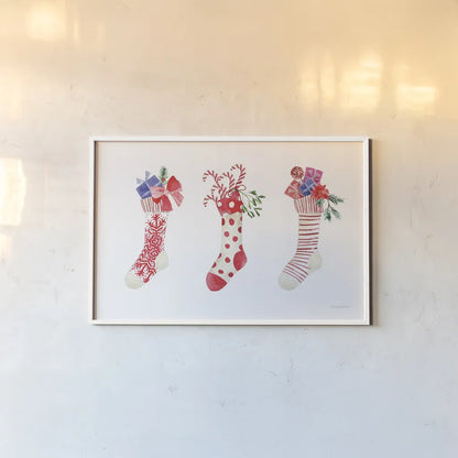 Decked Out Stockings by Mercedes Lopez Charro. shown as a paper print in a white frame. Available as a archival giclee rolled canvas, fine art paper, or poster print. SKU 77101i.