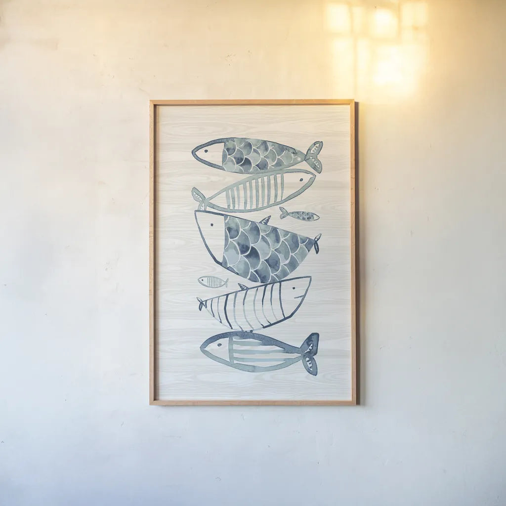 Driftwood Blue Fish II by Mercedes Lopez Charro. shown as a paper print in a natural frame. Available as a archival giclee rolled canvas, fine art paper, or poster print. SKU 82297h.