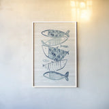 Driftwood Blue Fish II by Mercedes Lopez Charro. shown as a paper print in a white frame. Available as a archival giclee rolled canvas, fine art paper, or poster print. SKU 82297h.