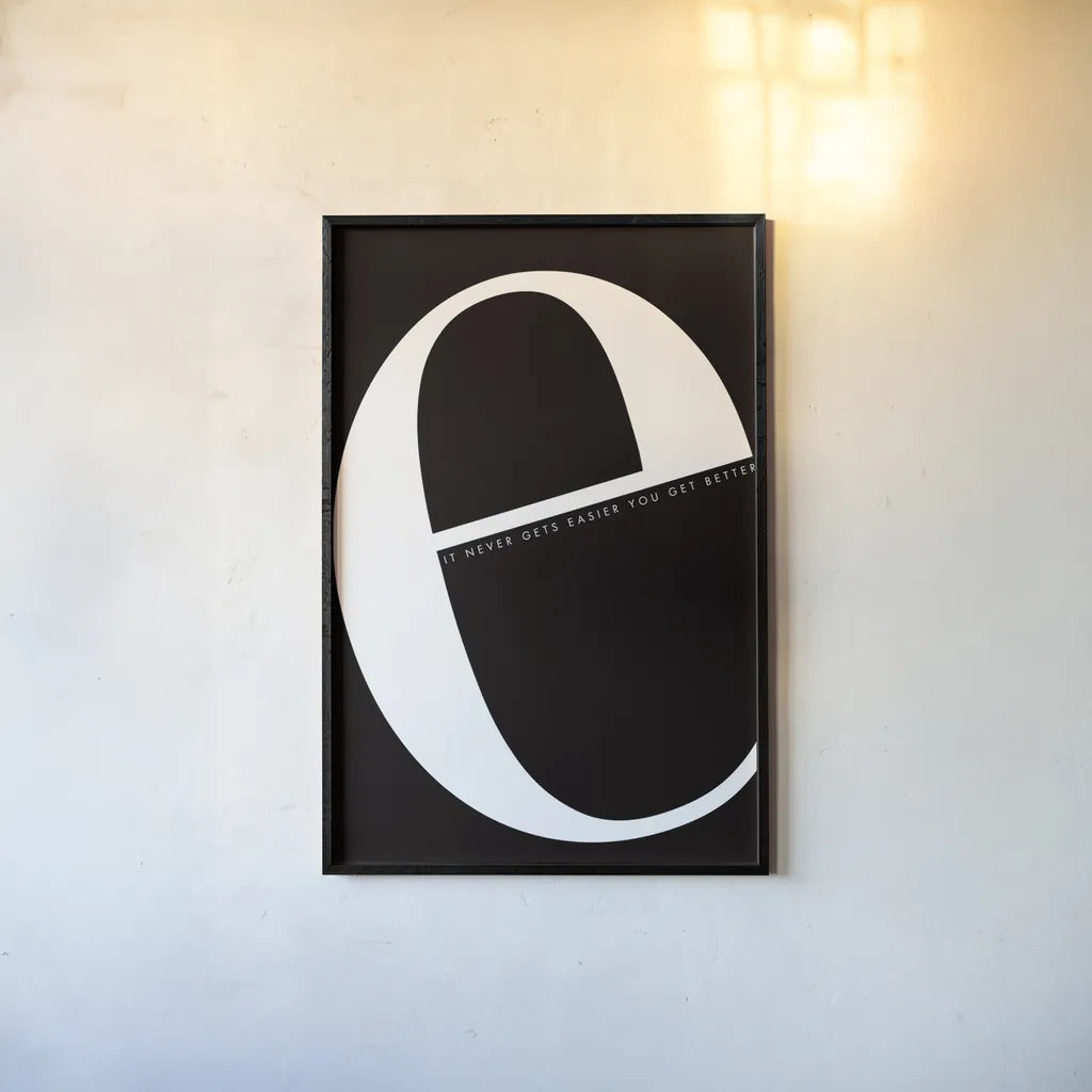 E is for Easier by Mercedes Lopez Charro. shown as a paper print in a black flame. Available as a archival giclee rolled canvas, fine art paper, or poster print. SKU 64138h.