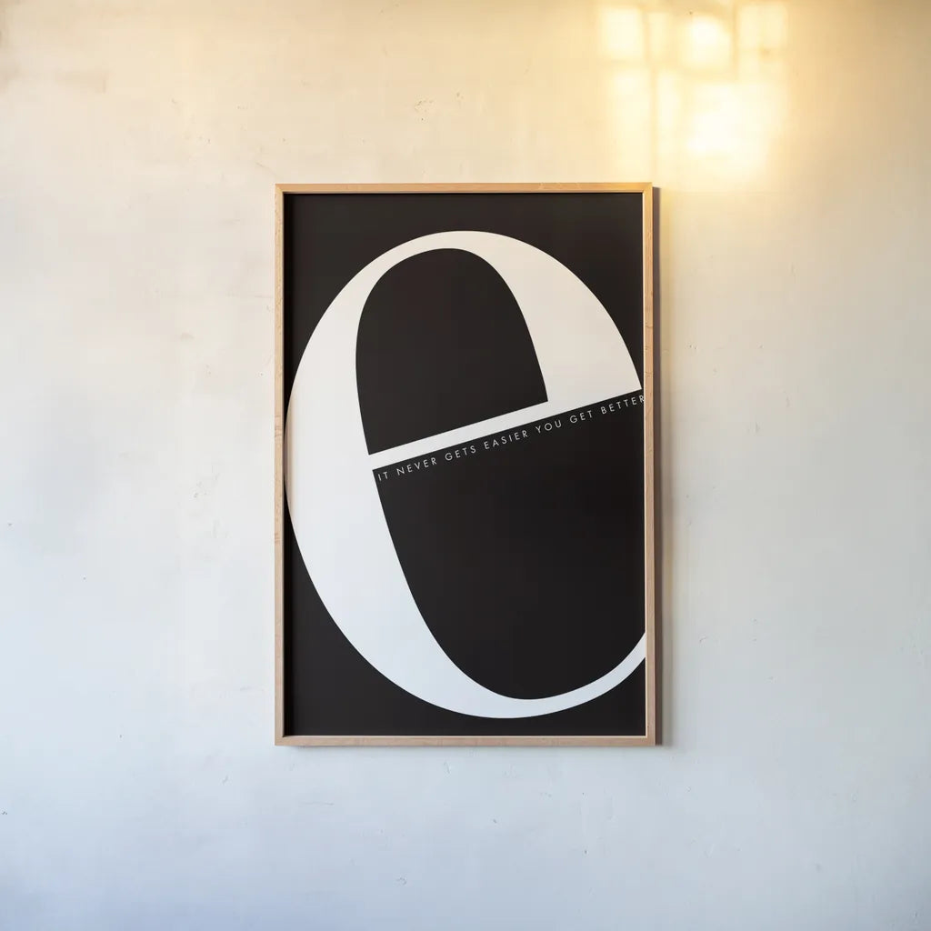 E is for Easier by Mercedes Lopez Charro. shown as a paper print in a natural frame. Available as a archival giclee rolled canvas, fine art paper, or poster print. SKU 64138h.