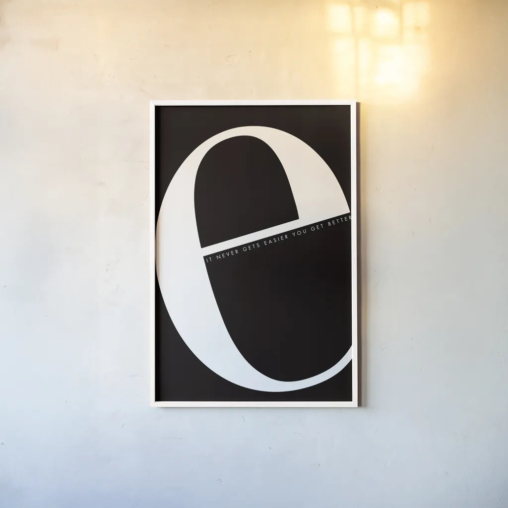 E is for Easier by Mercedes Lopez Charro. shown as a paper print in a white frame. Available as a archival giclee rolled canvas, fine art paper, or poster print. SKU 64138h.