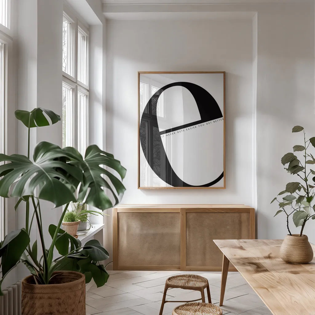 E is for Easier on White by Mercedes Lopez Charro. shown as a print in a natural wood frame in a dining room. Available as a archival giclee rolled canvas, fine art paper, or poster print. SKU 64145h.
