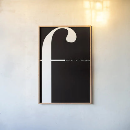 F is for Favourite by Mercedes Lopez Charro. shown as a paper print in a natural frame. Available as a archival giclee rolled canvas, fine art paper, or poster print. SKU 64139h.