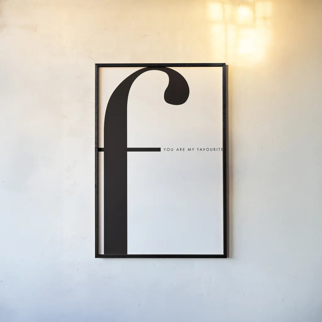 F is for favorite on White by Mercedes Lopez Charro. shown as a paper print in a black flame. Available as a archival giclee rolled canvas, fine art paper, or poster print. SKU 64146h.