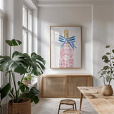 Flirty Champagne I by Mercedes Lopez Charro. shown as a print in a natural wood frame in a dining room. Available as a archival giclee rolled canvas, fine art paper, or poster print. SKU 92817h.
