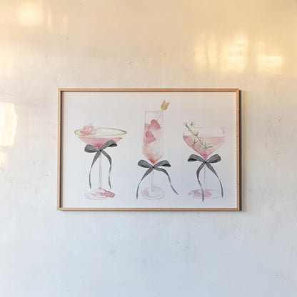 Flirty Champagne III Black Bows by Mercedes Lopez Charro. shown as a paper print in a natural frame. Available as a archival giclee rolled canvas, fine art paper, or poster print. SKU 96871i.