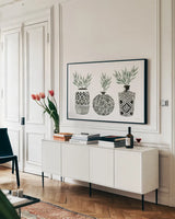 Geometric Vases I Green by Mercedes Lopez Charro. shown as a framed stretched canvas in a living room above a console. Available as a archival giclee rolled canvas, fine art paper, or poster print. SKU 66484i.