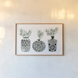 Geometric Vases I Green by Mercedes Lopez Charro. shown as a paper print in a natural frame. Available as a archival giclee rolled canvas, fine art paper, or poster print. SKU 66484i.