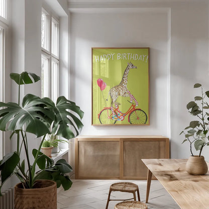 Giraffe Joy Ride I Birthday by Mercedes Lopez Charro. shown as a print in a natural wood frame in a dining room. Available as a archival giclee rolled canvas, fine art paper, or poster print. SKU 78198h.