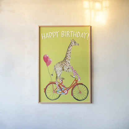 Giraffe Joy Ride I Birthday by Mercedes Lopez Charro. shown as a paper print in a natural frame. Available as a archival giclee rolled canvas, fine art paper, or poster print. SKU 78198h.