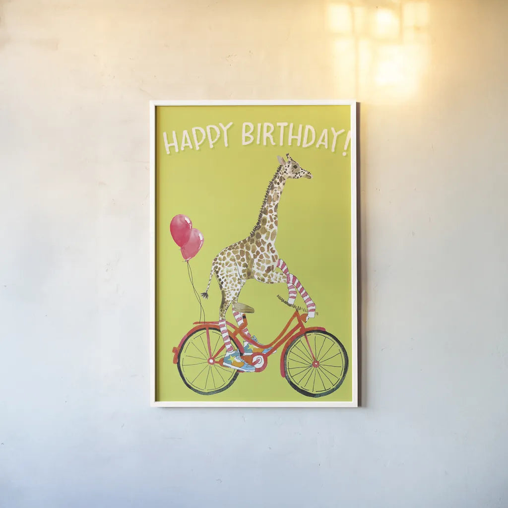 Giraffe Joy Ride I Birthday by Mercedes Lopez Charro. shown as a paper print in a white frame. Available as a archival giclee rolled canvas, fine art paper, or poster print. SKU 78198h.