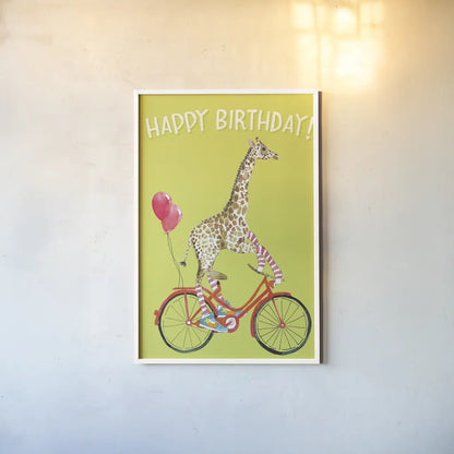 Giraffe Joy Ride I Birthday by Mercedes Lopez Charro. shown as a paper print in a white frame. Available as a archival giclee rolled canvas, fine art paper, or poster print. SKU 78198h.