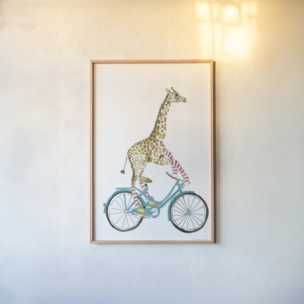 Giraffe Joy Ride I No Balloons by Mercedes Lopez Charro. shown as a paper print in a natural frame. Available as a archival giclee rolled canvas, fine art paper, or poster print. SKU 76120h.