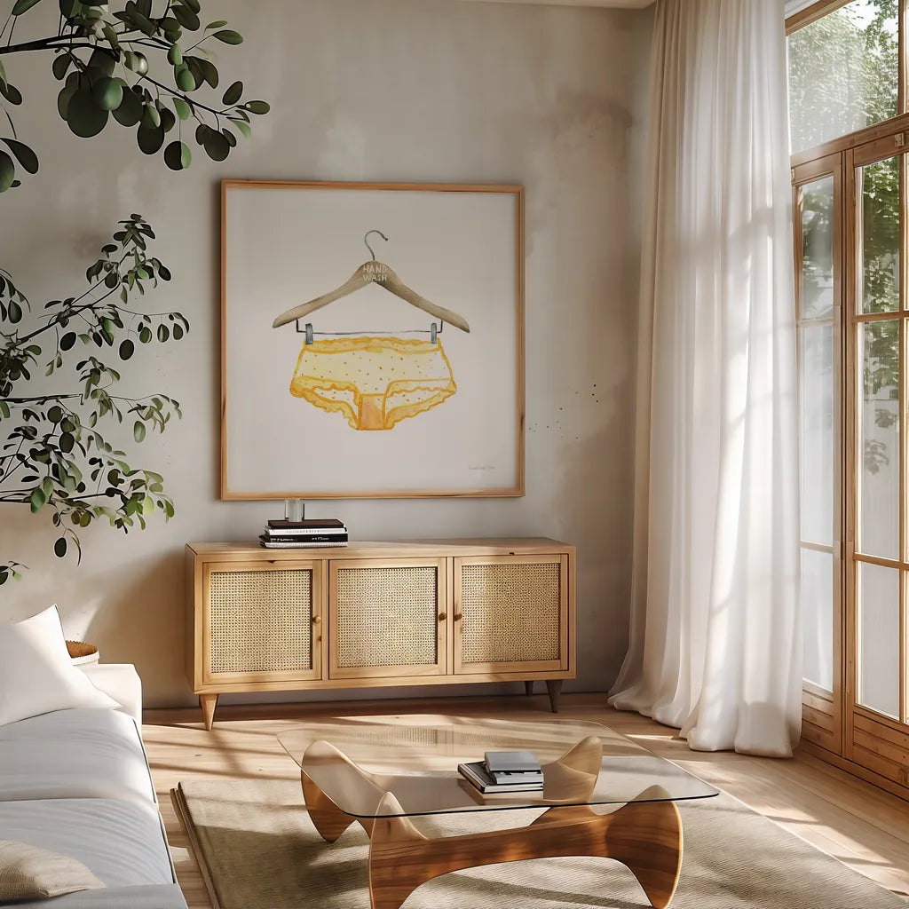 Hand Wash II by Mercedes Lopez Charro. Shown in a natural wood frame in a cozy modern living room. Available as an archival giclee rolled canvas, fine art paper, or poster print. SKU 75481a.