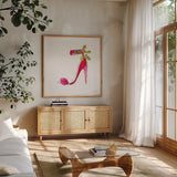Holiday Stiletto by Mercedes Lopez Charro. Shown in a natural wood frame in a cozy modern living room. Available as an archival giclee rolled canvas, fine art paper, or poster print. SKU 67983a.
